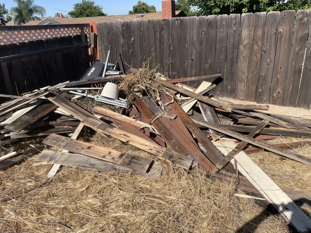 Yard waste and debris removal in Temecula Valley — brush and outdoor pile for Junk Corral